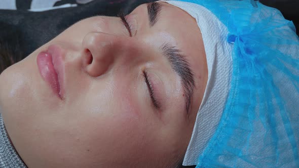 Girl After Lash and Eyebrow Lamination Procedure Close-up