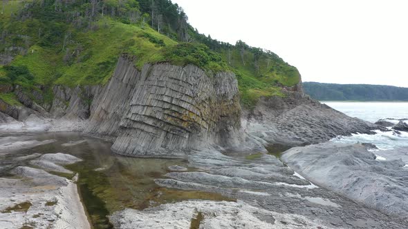 Flying Around Cape Stolbchaty, Volcanic Rock Formation on Kunashir island, Russia.