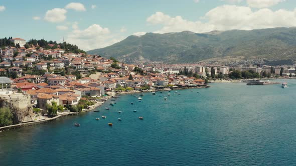 Drone Video of a City on a Mountain with Red Roofs alt