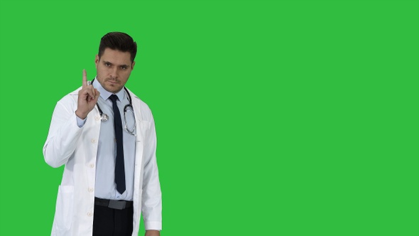 Doctor man medical professional making a point gesture alt