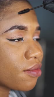 African Girl Doing Eyebrow Correction in Beauty Salon alt