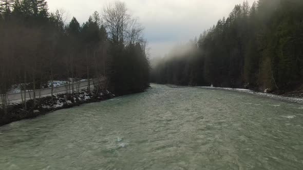 Aerial View of Chilliwack River with Snow During Winter Season alt