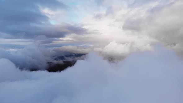 Amazing Aerial Shot: Drone Flying Over Fluffy Blue and White Clouds.