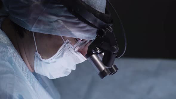 Female surgeon operating patient