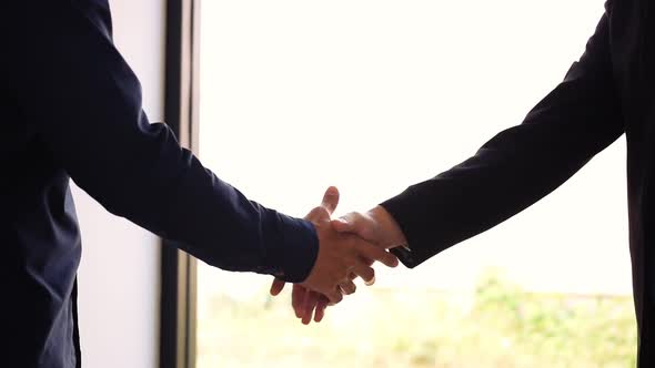 Two businessmen entrepreneurs or job interviews go well and shaking hands