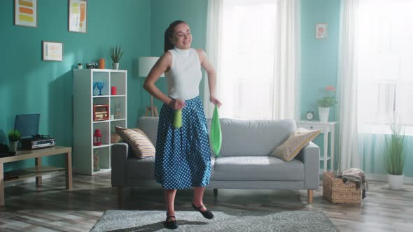 Woman Is Dancing In Flat With Cleaning Tools