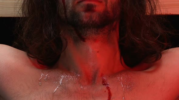 Jesus Christ With Bleeding Body Crucified on Cross Looking at Camera, Punishment alt