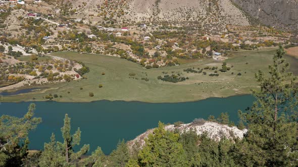 Beautiful Green Mountain Valley with Blue River and Settlement Top View alt
