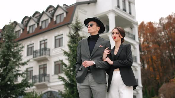 A Man and a Woman are Standing and Looking at Each Other alt