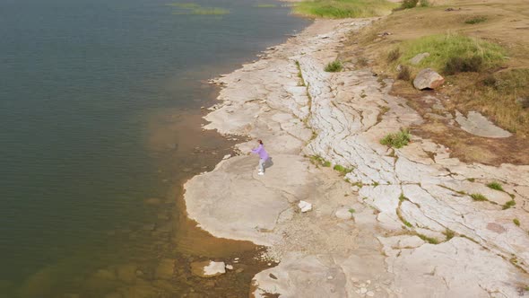 The Girl is Doing Fitness on the Lake Shore alt