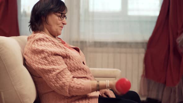 Elderly Woman Healthy Lifestyle.Mature Woman Training With Dumbbells.Elderly Home Exercising Workout alt