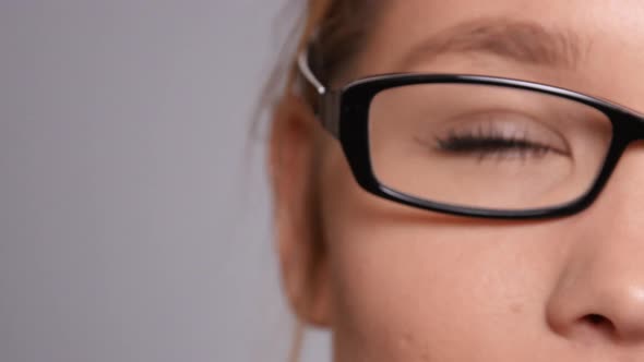 Extreme closeup of young woman's eye and face