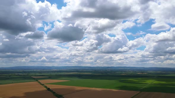 Aerial View Of Cloudy Sky And Agriculture Field