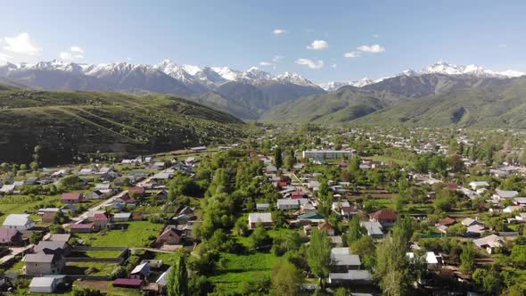 Aerial panorama of a mountain village. Beautiful spring landscape. Kazakhstan. 
