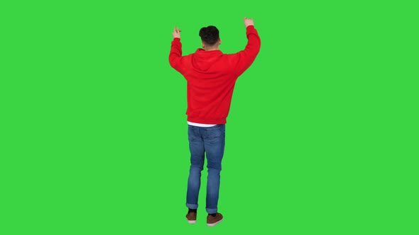 Casual Man Dancing in a Red Hoody on a Green Screen, Chroma Key alt