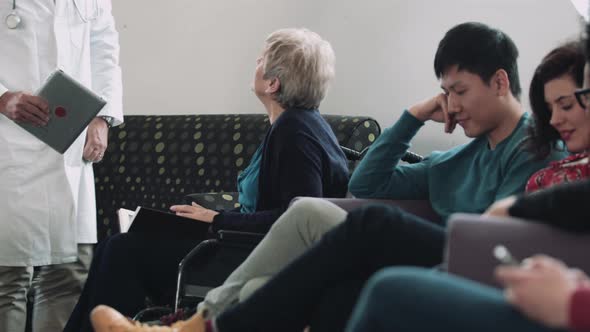 Doctor consulting patient in hospital waiting room