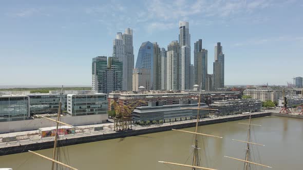 High Rise Buildings By The River In Puerto Madero, Buenos Aires, Argentina - ascending wide shot alt