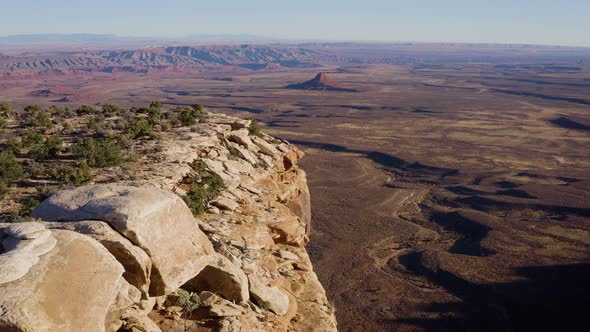 Aerial shot of the cliffs along the edge of Cedar Mesa in Southern Utah alt