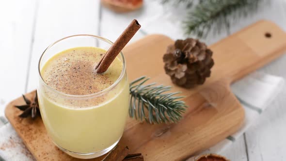 Homemade traditional Christmas eggnog drink in a glass