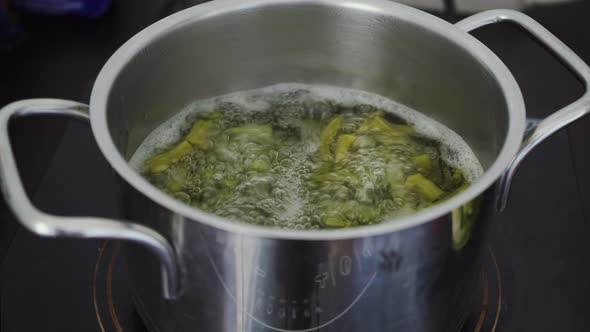Cactus food cooking in a pan of boiling water. A traditional native Mexican dish and street food kno alt