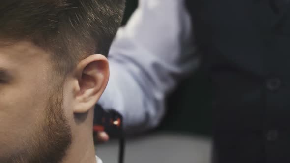 Close Up of a Man Getting His Hair Shaved By a Professional Barber alt