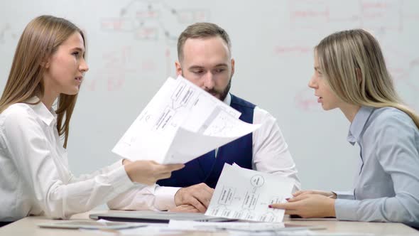 Two Young Disgruntled Businesswoman Partners Arguing About Mistake in Document alt