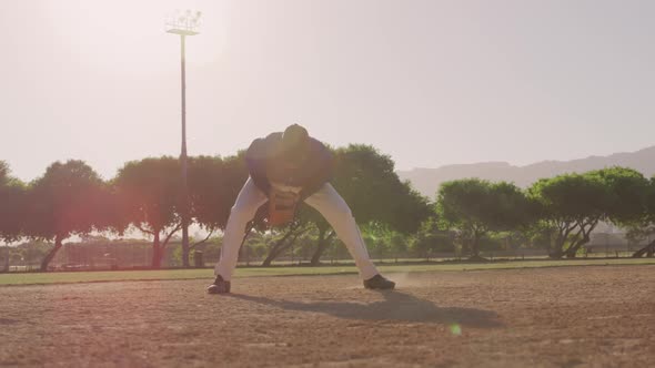 Baseball player catching a ball during a match alt