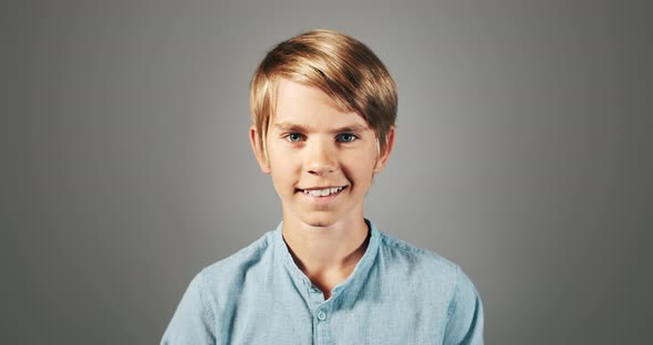 Smiling Boy Isolated On Grey Portrait