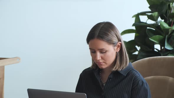 Happy Teen Girl Enjoy Using Laptop Sitting In Rocking Chair alt