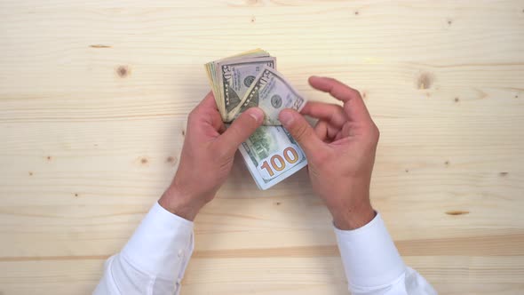 Hand grabbing dollars alt