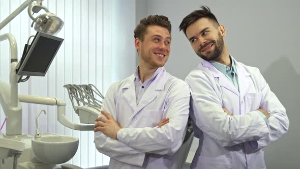Two Dentists Show Their Thumbs Up