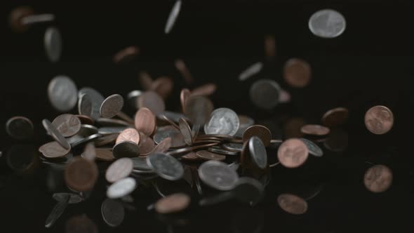 Coins falling in slow motion; shot on Phantom Flex 4K at 1000 fps alt
