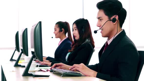 Business People Wearing Headset Working in Office alt