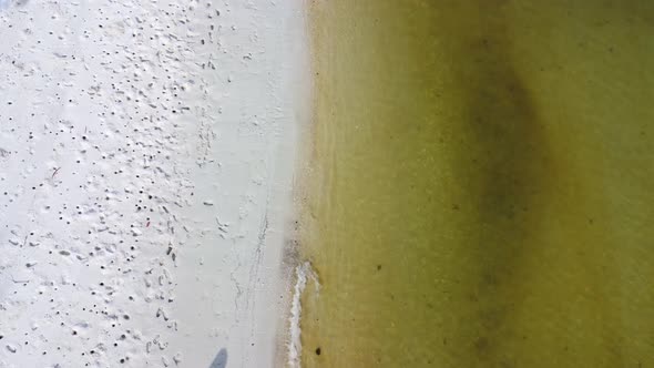 Aerial view from a drone of a happy Asian family of mother and daughters having fun playing alt