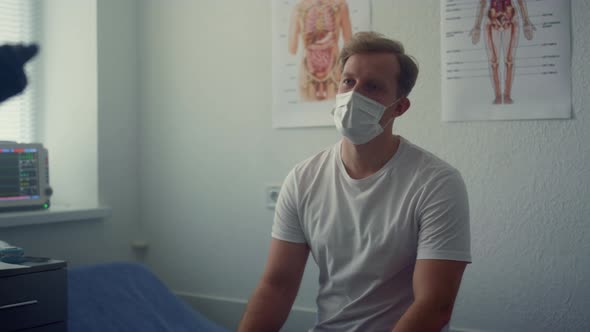 Patient Listening Doctor Appointment in Hospital Close Up alt