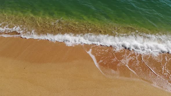Aerial Top View of Ocean Blue Waves Crashing on the Beach alt