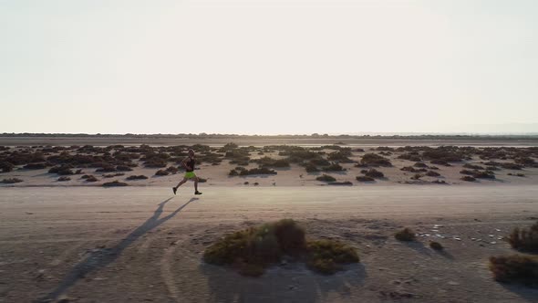 Aerial View of Athlete Doing Cross Country Running in Desert