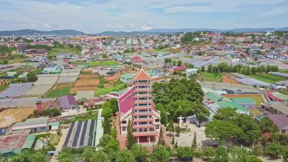 Panoramic View Church Against City with Colorful Buildings alt