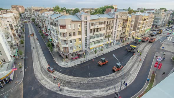 Asphalt Paver Roller and Truck on the Road Repair Site During Asphalting Timelapse alt