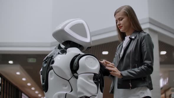 Happy Woman in Contact with Cyborg Robot alt