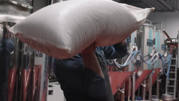 Brewery Worker Carrying Hops Bag alt