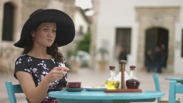 Beautiful Young Woman Enjoying Outdoor Relax in Street Cafe, Waiting for Someone alt