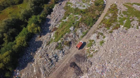 Shooting From the Height of the Dump Truck's Arrival at the Landfill Site. Aerial Photography.