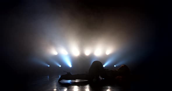 Woman Dancing Strip Plastic on Stage alt