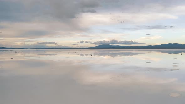 Sunset drone footage of Salar De Uyuni reflection water salt lake, desert in Bolivia 4K