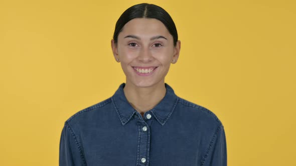 Smiling Latin Woman, Yellow Background  alt