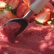 Hand with a Special Icecream Spoon is Scooping a Fresh Strawberry Ice Cream - VideoHive Item for Sale