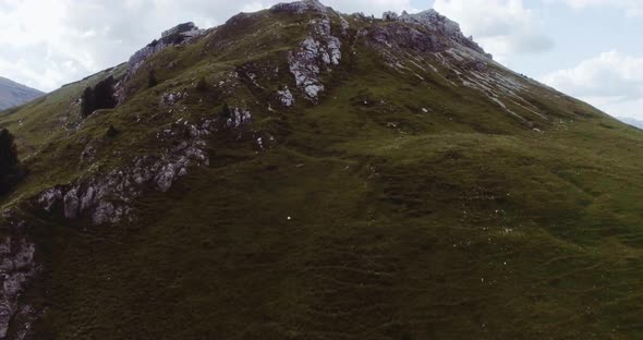Aerial Flight Above Mountain Top in Overcast Cloudy Weather alt