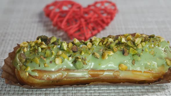 Dolly Shot of Custard Filled Eclair with Pistachio Flavor