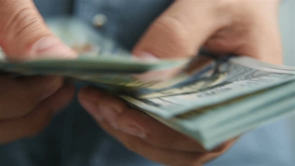 Businessman Hands Counting 100 Dollar Bills
